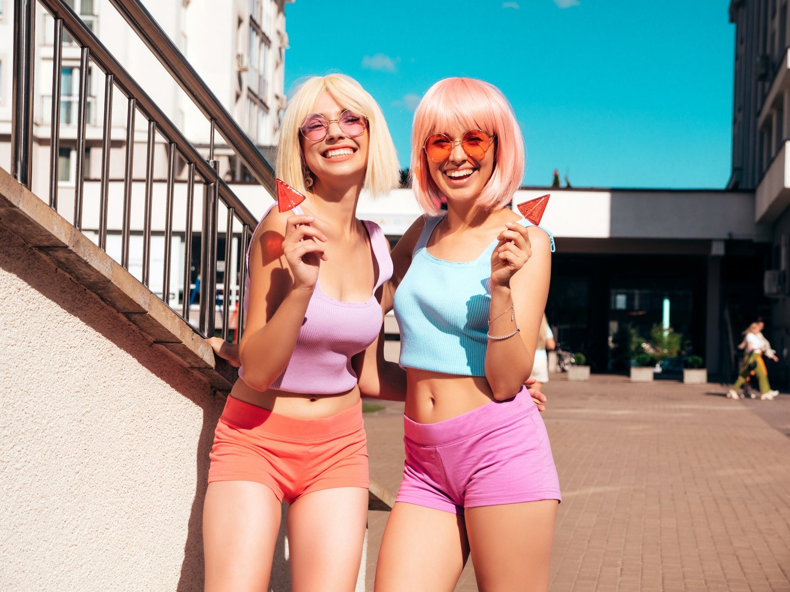 Two young beautiful women posing outdoors